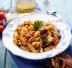 Penne con ragù di pesce e pomodorini secchi
